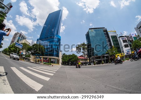 HO CHI MINH/ VIET NAM - JUNE 28, 2015: Place across the road under Le Loi street, with tall buildings, under the lens fish eyes.