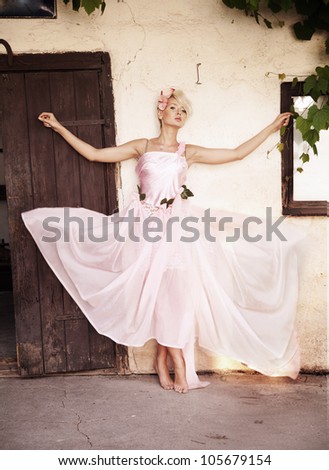 Young lady  in a pink dress