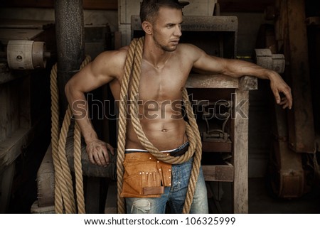 Well build man with rope