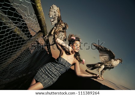 Elegance lady holding eagles