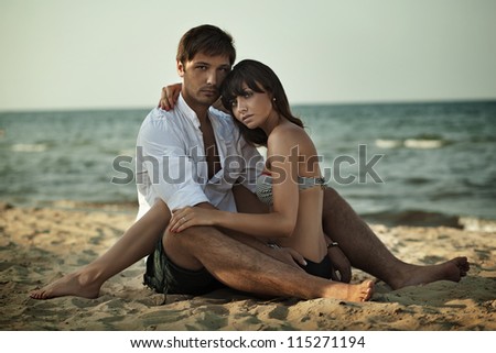 Young woman hugging on a beach