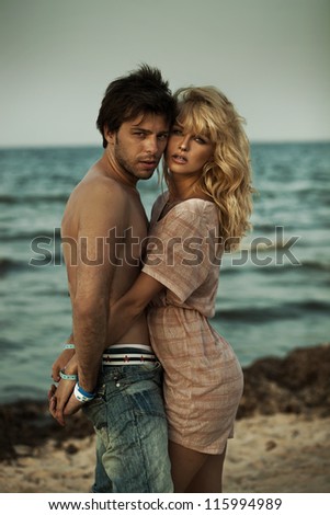Portrait of a hugging couple at the beach in a romantic mood