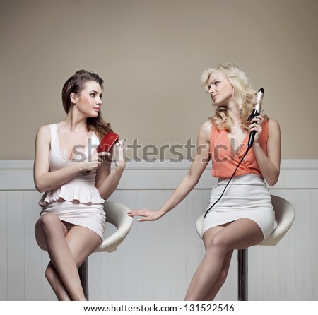 Two young ladies making preparations to a party
