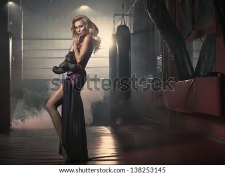 Elegant lady in boxing hall