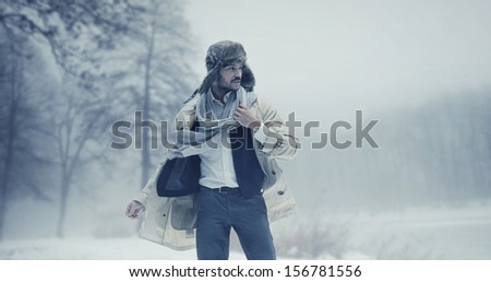 Handsome man in winter scenery