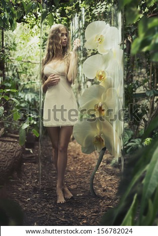 Young sexy woman in jungle