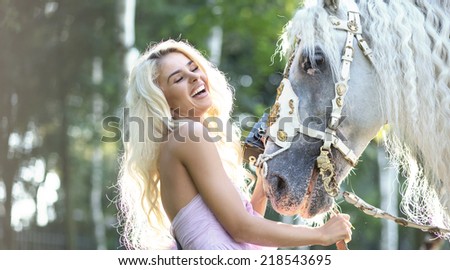 Portrait of a beauty blondie with horse