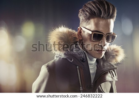 Fashionable man wearing winter jacket