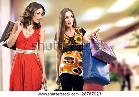Two young girls in a shopping center