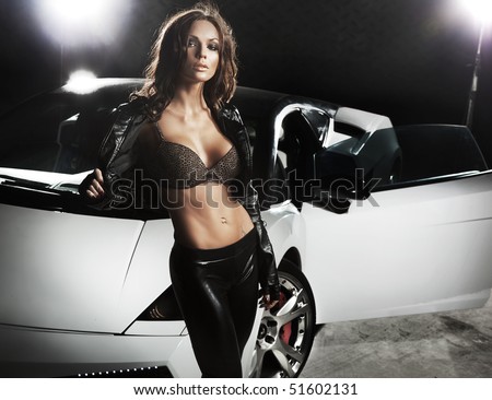 Sexy lady in front of a sport car