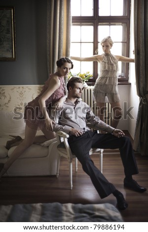 Young male and female models posing in a stylish interior