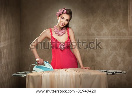 Pretty young lady ironing