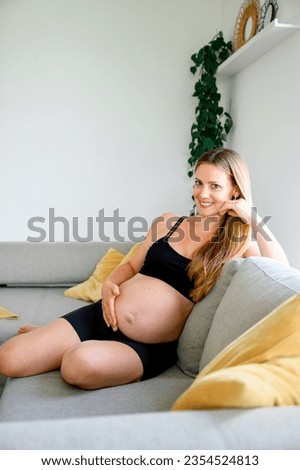 Similar – Image, Stock Photo Anonymous delicate mother sitting on floor with newborn at home