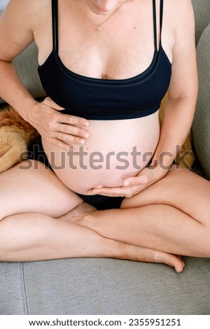 Similar – Image, Stock Photo Anonymous delicate mother sitting on floor with newborn at home