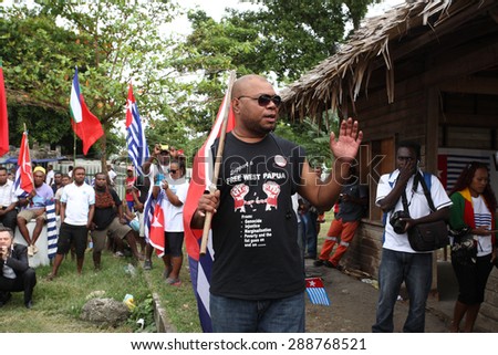 Honiara, Solomon Islands, June 18, 2015. A man in a black t shirt holds a speech asking for solidarity with West Papua\'s request to join the Melanesian Spearhead Group as a full member.