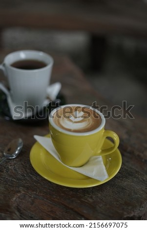 A cup of hot cappuccino and hot tea in ghe morning at coffee shop Imagine de stoc © 