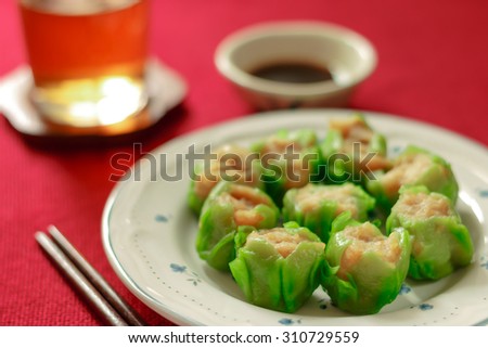 Close up Dim Sum Chinese food, Chinese cuisine ,Type of Chinese steamed dumpling concept with red background.