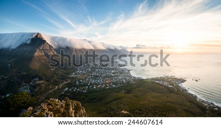 Panoramic view of table mountain and camps bay in Cape Town, South Africa at sunset.