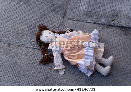 Abandoned rag doll, left in the dirt