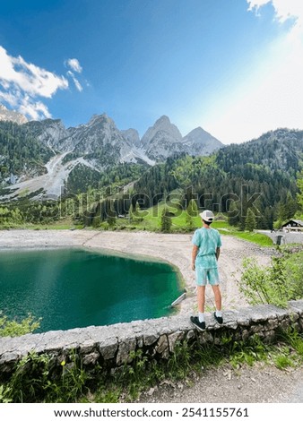 Similar – Foto Bild Auf Stein stehender Junge mit VR-Brille gegen Berg