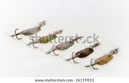 Spoon baits of the miscellaneous colour from metal with hook on white background