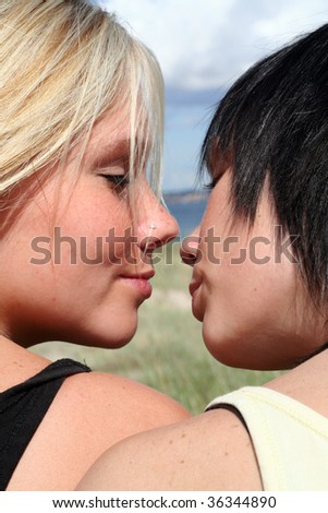 two girls flirting in the sun