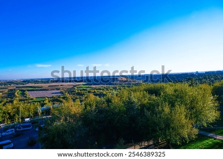 Similar – Foto Bild Ackerland umgeben von grünen Bäumen