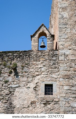 Old bell on abbey wall
