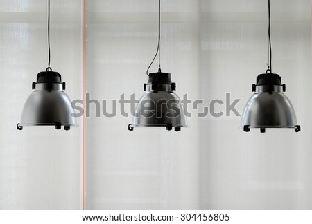 Industrial look pendant lamps over the windows
