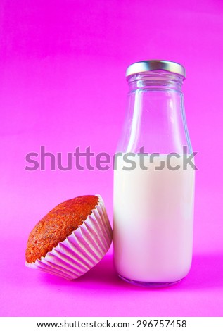Banana cake with milk bottle on purple background