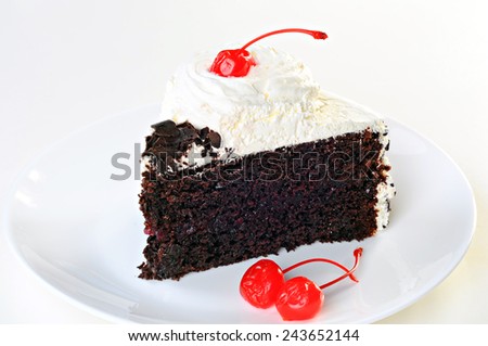 Cake Black Forest with whipped cream, candied cherry and chocolate, on plate, white background
