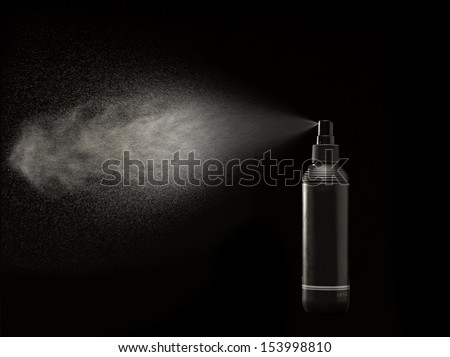 spray can against black spraying a mist of drops