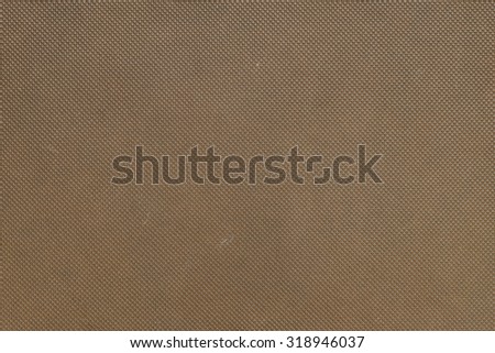 Closeup at front cover of brown note book background