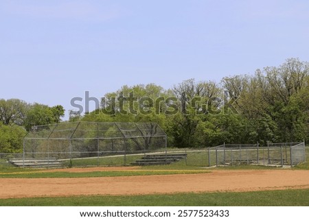 Similar – Image, Stock Photo Plain wooden bench in front of a wooden wall, with a window barricaded with square timbers.