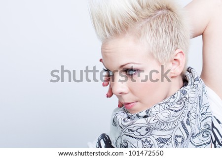 fashion model woman wearing scarf on gray background - studio shot