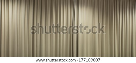 closed curtain with light spots in a theater