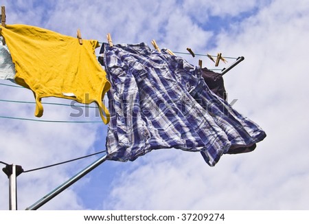 Freshly washed clothes hang out to dry on a sunny day