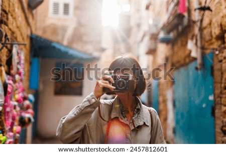 Similar – Image, Stock Photo Tourist woman taking pictures to La Alhambra in sunny day. Carlos V palace