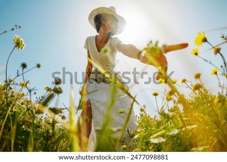 Similar – Image, Stock Photo Cute girl touching flowers in a french lavender field at sunset