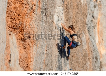 Similar – Image, Stock Photo Woman in a rock facing the sea doing a variation of handstand yoga pose