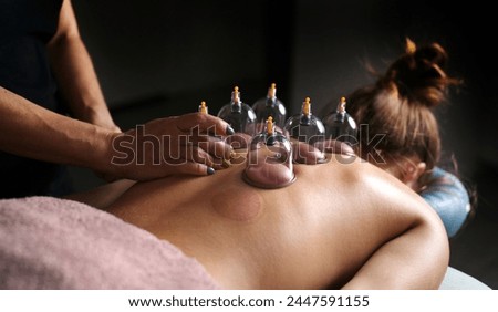 Image, Stock Photo Male therapist doing procedures with client in clinic