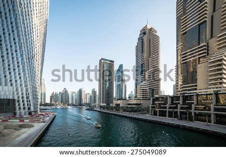 Panoramic view with modern skyscrapers and water channel of Dubai Marina, United Arab Emirates