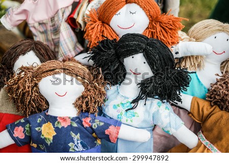 colorful sewed handmade dolls on a fair