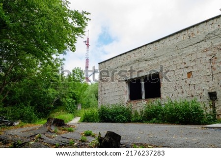 Former rocket missile base of Czechoslovakia on Devínska Kobyla hill over Bratislava, Slovakia. Ruin of the building on top of the hill with new mobile signal transmitter and look out tower.  ストックフォト © 
