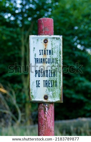 'State triangulation, damage is punishable'. Sign on top of geodetic point in Slovakia, hill Okopanec in Small Carpathian mountains. Sign in czech language - legacy of Czechoslovakia.  ストックフォト © 
