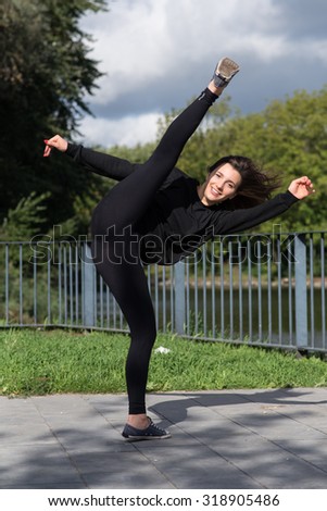 Girl practicing a high kick