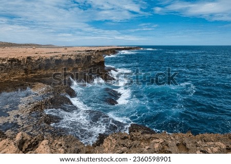 Similar – Image, Stock Photo Rough cave near sea during sunset