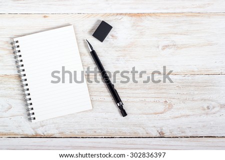 opening note paper and pen on wood texture background with copy space