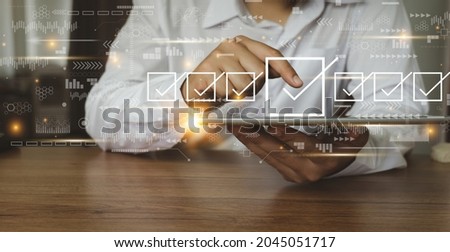 Businessman working with tablet. Checking mark up on the check boxes. Successful completion of business tasks. Digital marketing of statistics level up of graph. Business management goal strategy. 商業照片 © 