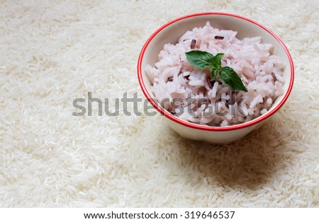 Leaf,rice,bowl on the rice seed background.